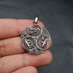 The Celtic Triskelion, symbolizing cycles of life and spiritual growth, is intricately captured in sterling silver. Choose your chain length to personalize this emblem of heritage. Embrace the artistry and symbolism with every wear--a fusion of style and ancient wisdom. Charm Measures 38 x 28mm Jewelry will come in a gift box * Please read shop policy before placing an order * *JEWELRY CARE* Sterling Silver will tarnish over time, but to help keep your jewelry looking beautiful - Clean with a so Celtic Gifts, Celtic Triskelion, Triple Spiral, Creative Necklace, Elven Jewelry, Celtic Dragon, Art Jewelry Design, Mens Rings Fashion, Bling Necklace