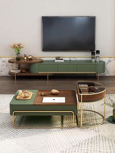 a living room scene with focus on the coffee table and television screen in the background