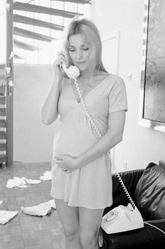 black and white photograph of a woman on the phone