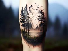 a person with a tattoo on their leg that has trees and birds flying in the sky