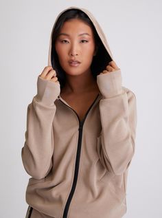 FEATURES & BENEFITS Unlock comfort and sophistication with the Brooke Reflective Hoodie. A sleek satin-lined hood and functional drawcord give this jacket an edge of luxury, while a functional front zipper, pocket thumbholes, and matching pants complete the look. For added comfort, this reflection of modern style features a CB length of 20-1/4". Make a statement with every wear. Satin Lined Hood With Functional Drawcord Functional Front Zipper Functional Front Pocket Thumbholes CB Length From CB Functional Long Sleeve Track Jacket With Drawstring Hood, Hooded Athleisure Track Jacket For Fall, Athleisure Hoodie With Zipper Closure, Athleisure Hoodie Outerwear With Zipper, Fall Athleisure Hooded Jacket With Zipper, Athleisure Hooded Jacket With Zipper, Fall Athleisure Hooded Jacket With Ribbed Cuffs, Functional Hooded Outerwear With Zip Cuffs, Fall Hooded Track Jacket With Drawstring Hood