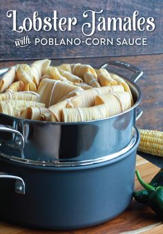 a pot filled with cooked corn on the cob next to a green chili pepper