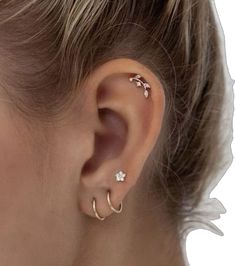 a close up of a person with ear piercings