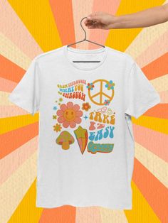 "Embrace the Retro Vibes with our Stay Groovy Shirt Collection! Get your groove on with these trendy Stay Groovy T-shirts, perfect for any groovy birthday party outfit or groovy party. Our Groovy Tee selection offers the perfect blend of vintage charm and contemporary style, making it a must-have for all the free-spirited souls out there. Express your inner hippie with our Stay Groovy Retro Tee, and let the world know you're all about peace, love, and good vibes. Don't miss out on this hip and s Groovy Short Sleeve T-shirt With Funny Print, Retro Multicolor Custom Print T-shirt, Retro White T-shirt For Birthday, White Graphic Tee With Retro Print, Retro Graphic Crew Neck Tee, Retro Short Sleeve Top For Birthday, Groovy White Short Sleeve Tops, White Groovy Short Sleeve Tops, Retro White Top For Birthday