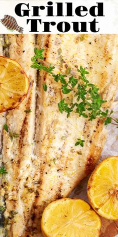 grilled fish with lemons and parsley on the side