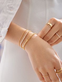 Embrace all things bride and beautiful with the Script Bride Pisa Bracelet. This accessory stuns with its gold beads and elegant “bride” lettering. So simple yet stylish, this bridal bracelet can be worn throughout your engagement, up until your wedding day. This bracelet features 4mm gold ball beads. Elegant Jewelry With Letter Beads For Everyday, Stackable Rose Gold Diamond Bracelet For Wedding, Elegant Gold Jewelry With Letter Beads, Gold Dainty Beaded Bracelets For Anniversary, Dainty Gold Beaded Bracelets For Anniversary, Minimalist Jubilee Bracelet For Wedding, Elegant Personalized Gold Beaded Bracelets, Elegant Stackable Diamond Bracelet For Wedding, Elegant Stackable Adjustable Name Bracelet