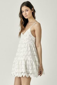 STYLE INFORMATION: Make any occasion special in the Davina White Crochet Mini Dress! Wave crochet knit shapes this casual dress that has adjustable straps, a V-neckline, and a fitted bodice. An empire waist tops a twirly mini skirt with a ruffled scalloped hem. Lined DETAILS & CARE: 100% Polyester. Rayon Lining. Machine wash cold. Imported. SHIPPING: We offer free shipping over $100 for all orders in the Continental US. Chic V-neck Crochet Dress For Day Out, V-neck Mini Dress With Adjustable Straps For Day Out, Spring Mini Crochet Dress For Brunch, Casual V-neck Crochet Dress For Day Out, Summer V-neck Crochet Dress For Brunch, Summer Crochet V-neck Dress For Brunch, V-neck Crochet Dress With Lace Trim, Spring V-neck Crochet Sundress, Chic Crochet Lace Dress With Spaghetti Straps