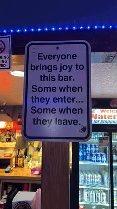 a sign in front of a store that says everyone brings joy to this bar some when they enter