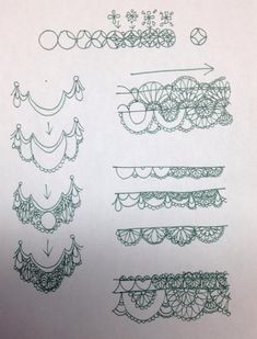 several laces are drawn on top of a piece of paper