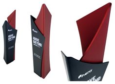 three red and black awards are shown in the shape of an inverted cone, with one curved corner at the top