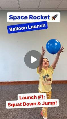 a young boy is playing with a ball in an office space rocket balloon launch event