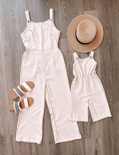 "This M O M M Y + M E jumpsuit is MUST HAVE this summer! Plus, it has pockets I T E M D E S C R I P T I O N * Material: 95% Polyester 5% Spandex * Sizing runs true to size * Back off-white zipper * It has pockets!! * Calf length * Sizing runs true to size. We only recommend sizing up if you would some extra wiggle room. * Infant sizes include snaps between the legs to make diaper changes easy and fuss-free. S I Z I N G Adult: S: Length 52.5\" | Chest 34\" | Waist 29\" | Leg width 10.5\" M: Lengt Casual Sleeveless Jumpsuit And Romper Matching Set, Casual Sleeveless Jumpsuits And Rompers Matching Set, Casual Sleeveless Jumpsuit And Romper Set, Summer Day Out Matching Set Jumpsuits And Rompers, Spring Casual Jumpsuits And Rompers Matching Set, Sleeveless Summer Jumpsuits And Rompers Matching Set, Sleeveless Matching Set Jumpsuits And Rompers For Summer, Summer Vacation Matching Set Jumpsuits And Rompers, Casual Beach Jumpsuits And Rompers Matching Set