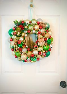 a christmas wreath hanging on the front door