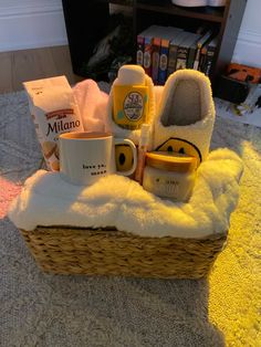 a basket filled with items sitting on top of a carpet next to a book shelf