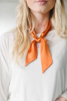 "Give your look an instant style upgrade with this classic silk skinny scarf. Wear knotted around your neck or styled as a choker, adorn your hair and wear as a turban/headband, wrap it around your wrist for arm candy or use it as an accent for your handbag. Color: Dark Orange* 100% Silk charmeuse 2\" wide x 36\" long Hand wash, lay flat to dry *Also available in: Black, Grey, Taupe, Ivory, Wine, Royal Blue, Olive Green, Mauve" Fred Jones Costume, Orange Scarf Outfit, Neck Tie Outfit, Scarf Hairstyles Short, Tie Outfit, September Fashion, Headband Scarf, Headband Wrap, Silk Neck Scarf