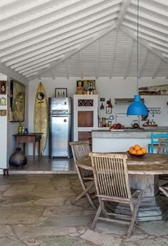 a kitchen with a table and chairs in it