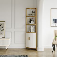 a living room with white walls and wooden flooring, an open shelving unit in the corner