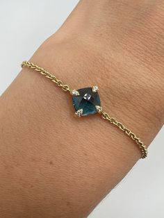 18K Yellow Gold Diamond 0.06ct Blue Topaz Chain Bracelet 6.5 to 7.5 inch A perfect gift for your little loved one for any special occasion or holiday!  Total Bracelet Weight: 4.35g Bracelet Length: 6.5 to 7.5 inches  Bracelet Width: 11.37mm Bracelet closure: Lobster Claws  Item will be placed in a Gift Box. * Elegant Blue Jewelry For Birthday Gift, Blue Diamond Bracelet For Gift, Blue Diamond Bracelets As Gift, Yellow Gold Bracelets With Blue Topaz For Gift, Yellow Gold Bracelet With Blue Topaz For Gifts, Yellow Gold Blue Topaz Bracelets Gift, Elegant Blue Diamond Bracelet As A Gift, Blue Diamond Bracelet Gift, Sapphire Round Diamond Bracelet Gift