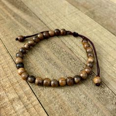 This natural wood goes perfectly with any other bracelet and style and keeps you close to the ground and connects you to nature. ▪️Since this is a sliding closure it fits all wrist from 7"-8.5" ▪️Bead size is 6mm ▪️The nylon cord is strong and durable and won't wear down as your slide it.   ▪️It's not recommended to wear in the shower or bath. Wood Beads Jewelry, Sandalwood Bracelet, Brown Bracelet, Favorite Jewelry, Jewelry Bracelets, Beaded Bracelets, Accessory Gift, Beads, Electronic Accessories