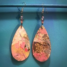 "*Feather light Handmade Wood Teardrop Earrings. *Each side Unique--front and back--no plain sides. *Pale Green crystal beads with Pink centers. *Wood with handmade/printed paper in a 'Japanese blossom design, Marbled with Pinks and Gold. *Gold edges. *Gold wires, Nickel free. *Total size 4\" x 1.25\" Drop 2.5\" x 1.25\" *Packed with white and colored tissue with a bow." Artsy Pink Earrings For Festivals, Handmade Pink Bohemian Teardrop Earrings, Bohemian Pink Teardrop Dangle Earrings, Pink Bohemian Teardrop Earrings, Bohemian Pink Teardrop Earrings, Bohemian Teardrop Hand Painted Earrings, Pink Teardrop Festival Earrings, Pink Teardrop Earrings For Festival, Wood Teardrop Earrings