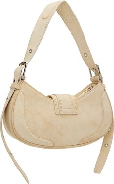 Crackled leather shoulder bag in beige. · Detachable and adjustable shoulder strap · Pin-buckle tab at face · Magnetic press-stud flap · Zip closure · Patch pocket at interior · Faux-suede lining · Logo-engraved silver-tone hardware · H6 x W11.25 x D3.25 Supplier color: Vintage white Everyday Suede Shoulder Bag With Silver-tone Hardware, Beige Leather Shoulder Bag With Silver-tone Hardware, Beige Leather Baguette Bag With Adjustable Strap, Chic Suede Shoulder Bag With Silver-tone Hardware, Chic Beige Suede Shoulder Bag, Suede Shoulder Bag With Detachable Handle, Beige Suede Shoulder Bag, Chic Soft Leather Beige Saddle Bag, Chic Suede Bag With Metal Hardware