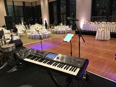 a large room with many tables and chairs set up for a wedding or other function