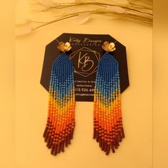 the earrings are made out of multicolored beads