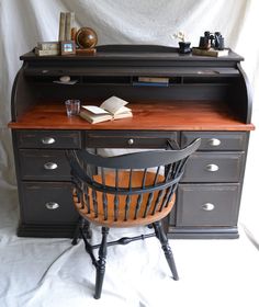 a desk with a chair and a book on it