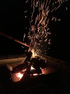 the fire is lit up and it looks like sparks are coming out of its mouth