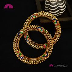 This is a beautiful pair of gold tone bangles crafted with beads border and Peacock enamels. Size : 2.6 PLEASE NOTE: * This is an imitation/fancy jewellery and don't come with any precious metals or stones. It is handmade and slight inconsistencies, if any, in production are not considered defects, and it adds to the character and uniqueness of the product. * The color/texture of the product you see in the pictures might vary slightly with the original depending on the screen settings of your gadget - factors such as the screen brightness, color setting, blue light filter, or white balance of your monitor/screen. Please reach out to us if you have doubts about the color. *No exchange or returns applicable. White Balance, Bangles Indian, Bead Bangles, Fancy Jewellery, Light Filter, Stone Gold, Jewellery Sets, Color Textures, Indian Jewellery