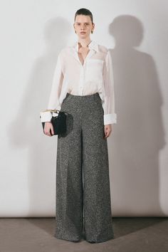 Crafted with the finest materials, these pants exude elegance and exclusivity. With a wide-leg design and timeless tweed fabric, they offer both comfort and style. Elevate your wardrobe with these chic pants. Satin Shirt Outfit, Wide Leg Pants Outfit, Mean Blvd, Chic Pants, Organza Fabric, Satin Shirt, Tweed Fabric, Leg Design, Cuff Sleeves