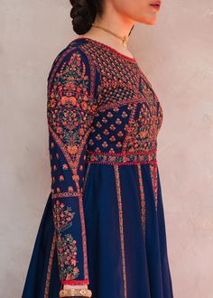 Pishwas Frock and Sharara Blue Pakistani Wedding Dress is a magnificent attire that will give you your desired magical look on the big day. Lavish designs, embroidery, and floral designs make this beautiful Pishwas Dress an epitome of beauty. Traditional Pishwas: The beautiful Pishwas Frock in blue color is adorned with ravishing intricate designs and floral details. Hand-crafted details of embroidery, tilla, and dabka make this stunning Pishwas Dress in premium lawn your priority for the weddin Semi-stitched Embroidered Gown For Navratri, Multicolor Embroidered Gown With Resham For Eid, Multicolor Embroidered Gown For Eid, Traditional Semi-stitched Gown With Floral Embroidery, Multicolor Embroidered Gown With Resham Embroidery For Eid, Unstitched Embroidered Chinon Gown, Maxi Blue Lehenga With Intricate Embroidery, Maxi Length Blue Lehenga With Intricate Embroidery, Festive Gown With Multicolor Intricate Embroidery