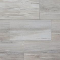 a white tile floor with grey and beige tones