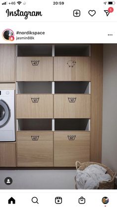 an instagram photo of a washer and dryer in a room with wooden cabinets