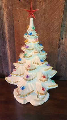 a ceramic christmas tree on a wooden table