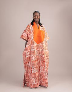 Indulge in the radiant allure of culture and style with the Ofuure Maxi Dress. This stunning Adire and Asooke Bubu in vibrant orange embodies the spirit of celebration and sophistication. With a perfect fusion of traditional Adire and regal Asooke, the dress exudes timeless elegance. The flowing silhouette and captivating hue make it an ideal choice for any occasion, ensuring you stand out with grace and confidence. Please note: This gown fits all sizes, and it is available in regular and tall l Fitted Bubu Gown Styles, Bubu Gown Styles Lace, Bubu Dress, Tall Maxi Dress, Bubu Gown, Bubu Gown Styles, Dress African Print, African Prom Dresses, Dress African