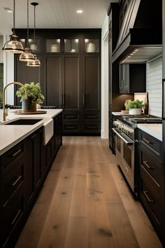 a large kitchen with dark wood cabinets and white counter tops, along with stainless steel appliances