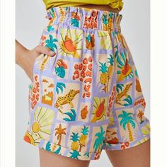 Farm Rio Patch Print Shorts Description: Farm Rio Shorts With Elastic Waist With Pineapples, Suns, Palm Trees And Leopards. Cuff. Color: Lilac/Gold/Yellow Material: Cotton, Elastane S: Waist: ~ 13.5 Inches Inseam: ~ 4 In L: Waist: ~ 16 Inches Inseam: ~ 4 In Purple Summer Shorts For Vacation, High Waist Purple Bottoms For Beach, Summer Purple Bottoms With Pockets, Purple Bottoms With Built-in Shorts For Vacation, Purple Bottoms For Vacation Beach Season, Purple Vacation Bottoms For Beach Season, Purple Bottoms For Beach Vacation, Vacation Purple Bottoms With Built-in Shorts, Purple Short Length Bottoms For Vacation