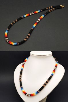 Adorn yourself with the elegance of this seed bead ethnic necklace, inspired by Native American traditions. The ethnic choker design and intricate beadwork make it a stylish and symbolic piece. Southwestern Black Beaded Necklaces For Festivals, Handmade Southwestern Black Beaded Necklace, Southwestern Black Beaded Necklace For Festivals, Southwestern Style Black Beaded Necklaces As Gift, Southwestern Black Beaded Necklaces For Gifts, Southwestern Style Black Beaded Necklaces For Gifts, Southwestern Black Beaded Necklace Gift, Southwestern Style Black Beaded Necklace For Gift, Spiritual Colorful Beads Choker Necklace