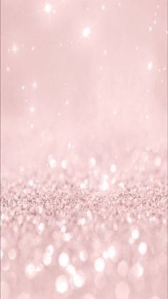 a pink glitter background with sparkles on the top and bottom half of the image