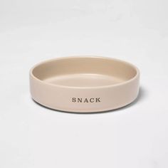 a small dog bowl with the words snack on it