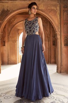 Navy blue gown with cutdana and sequin embellishment.
Component: 1
Embellished
Neckline: Round
Sleeve Length: Sleeveless
Fabric: Tussar Silk
Color: Blue
Cutout at the sides
Open back
Closure: Back hook and zip - Aza Fashions Blue Indo Western Dress, Navy Blue Gown, Indo Western Gown, Embellished Gown, Blue Gown, Indian Couture, Ladies Gown, Gowns Online, Indian Fashion Designers