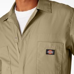 Dickies Men's Short Sleeve Coveralls Khaki 33999KH Dickies Short Sleeve Coveralls were first created over 90 years ago with the intention of protecting your street clothes at work. Originally made of a heavy denim with button-up fronts, the Dickies Coverall has evolved with a new fabrication consisting of a Poplin/Poly/Cotton blend now in a variety of colors and zips. As one of the most trusted Dickies products featuring a generous fit in the shoulders and chest, this universally adaptable style Long Sleeve Overalls With Pockets For Outdoor, Utility Long Sleeve Overalls With Button Closure, Dickies Coverall, Dickies Shorts, Street Clothes, Coverall Jumpsuit, Work Uniforms, Icon Collection, Street Outfit