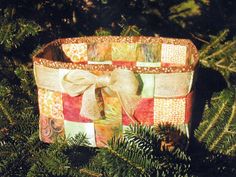 a decorated basket sitting on top of a tree