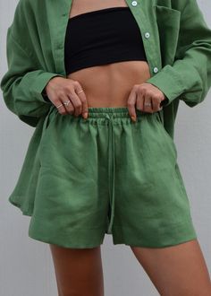 Discover our effortlessly chic forest green linen shorts. Crafted from premium European linen, these shorts offer exceptional softness and comfort. Perfect for a day at the beach, a casual city outing, or relaxed weekend wear. Featuring a wide leg, convenient side pockets, and a comfortable elastic waistband, they're designed to elevate your summer wardrobe. We prioritize quality and sustainability.  Our linen is OEKO-TEX Standard 100 certified, meaning it's free from harmful chemicals. DETAILS:  - Wide Linen Shorts - Loose Fit  - Two side Pockets - Elastic Band  - European Softened Linen  - Handmade in our small studio in Siauliai SIZE IN THE PICTURE:  The model in our photos is wearing a size S. The Model's height is 5'5"/ 165cm. SIZE CHART:  *Please note that this chart indicates garmen Solid Color Summer Shorts, Summer Relaxed Fit Solid Color Shorts, Relaxed Fit Solid Color Summer Shorts, Relaxed Fit Solid Color Shorts For Summer, Solid Color Summer Shorts With Relaxed Fit, Relaxed Fit Solid Shorts For Vacation, Green Bermuda Shorts With Built-in Shorts For Summer, Green Knee-length Shorts For Vacation, Casual Green Relaxed Fit Pajama Shorts