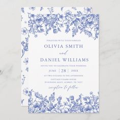 a wedding card with blue flowers on it