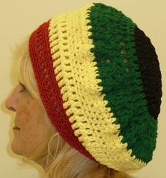 a woman wearing a multicolored crocheted hat