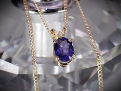 This little vintage treasure is a 14K yellow & rose gold natural blue sapphire and diamond oval solitaire pendant necklace. The pendant measures approx. 3/16" wide x 3/8" tall (incl. bale). It was appraised without the chain and can be purchased without chain. Just message us for details. It suspends along a delicate 18" 14K rose gold chain that secures with a spring ring clasp and compliments the pendant beautifully. This necklace weighs 1.53 grams. Please bear in mind this is a previously owne Formal Oval Jewelry With Birthstone, Oval 14k Gold Necklace With Vvs Clarity, 14k Gold Oval Necklace With Vvs Clarity, Oval Birthstone Jewelry For Formal Occasions, Oval 14k Stamped Necklaces For Anniversary, Oval Sapphire Jewelry With Vvs Clarity, Oval Jewelry With Diamond Accents For Gift, Oval Link Necklace With Diamond Accents For Gift, Jewelry Presentation