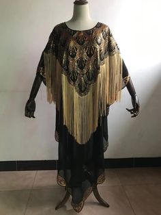 Experience the embodiment of timeless African elegance with our Dashiki Abaya, a true masterpiece meticulously designed to celebrate cultural richness and contemporary style. Crafted with the utmost care and attention to detail, this attire is a harmonious blend of tradition and modernity, making it the ideal choice for women who appreciate the beauty of African heritage and fashion-forward aesthetics. Chiffon Fabric: Our Dashiki Abaya is crafted from soft and breathable chiffon fabric, which of Nigeria Clothes, Mermaid Sequin Dress, Dashiki Fashion, Africa Clothing, African Suit, African Heritage, Abaya Designs, Sequin Maxi Dress, Oversized Dress