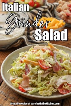 a salad with lettuce, tomatoes and meat in it on a white plate